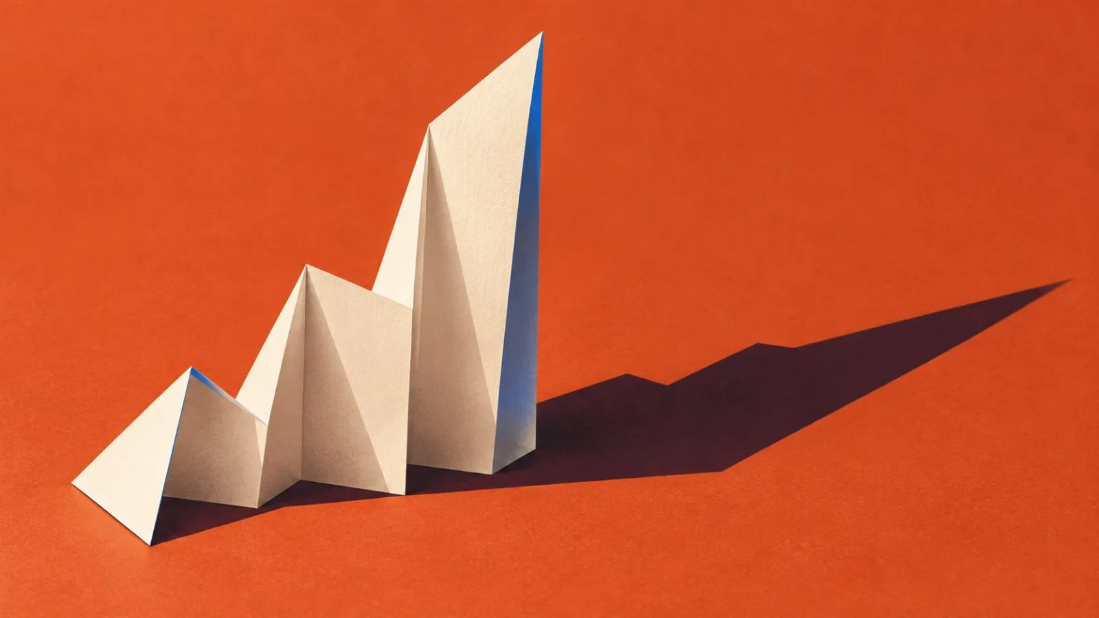 A folded earnings report rests on a warm terracotta surface / TokenPost.ai