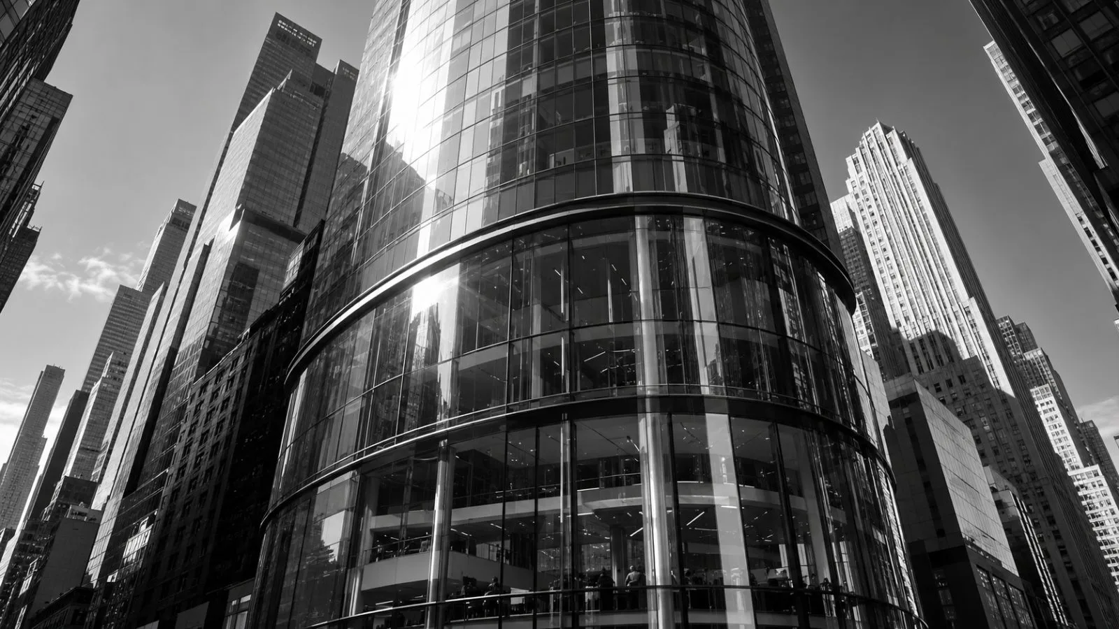 Morning light reflects across a glass exchange facade / TokenPost.ai
