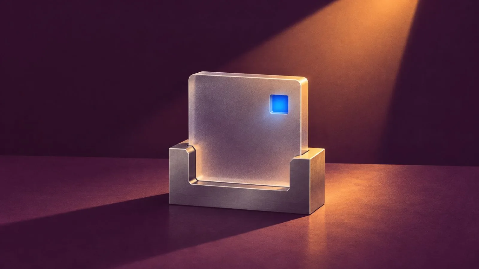 A glass security tile sits in a precision-cut metal cradle / TokenPost.ai