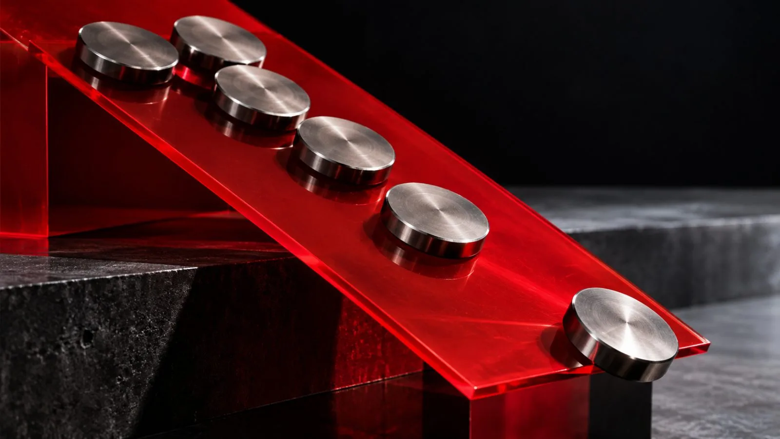 Six metal tokens tilt toward the edge of a red ramp / TokenPost.ai
