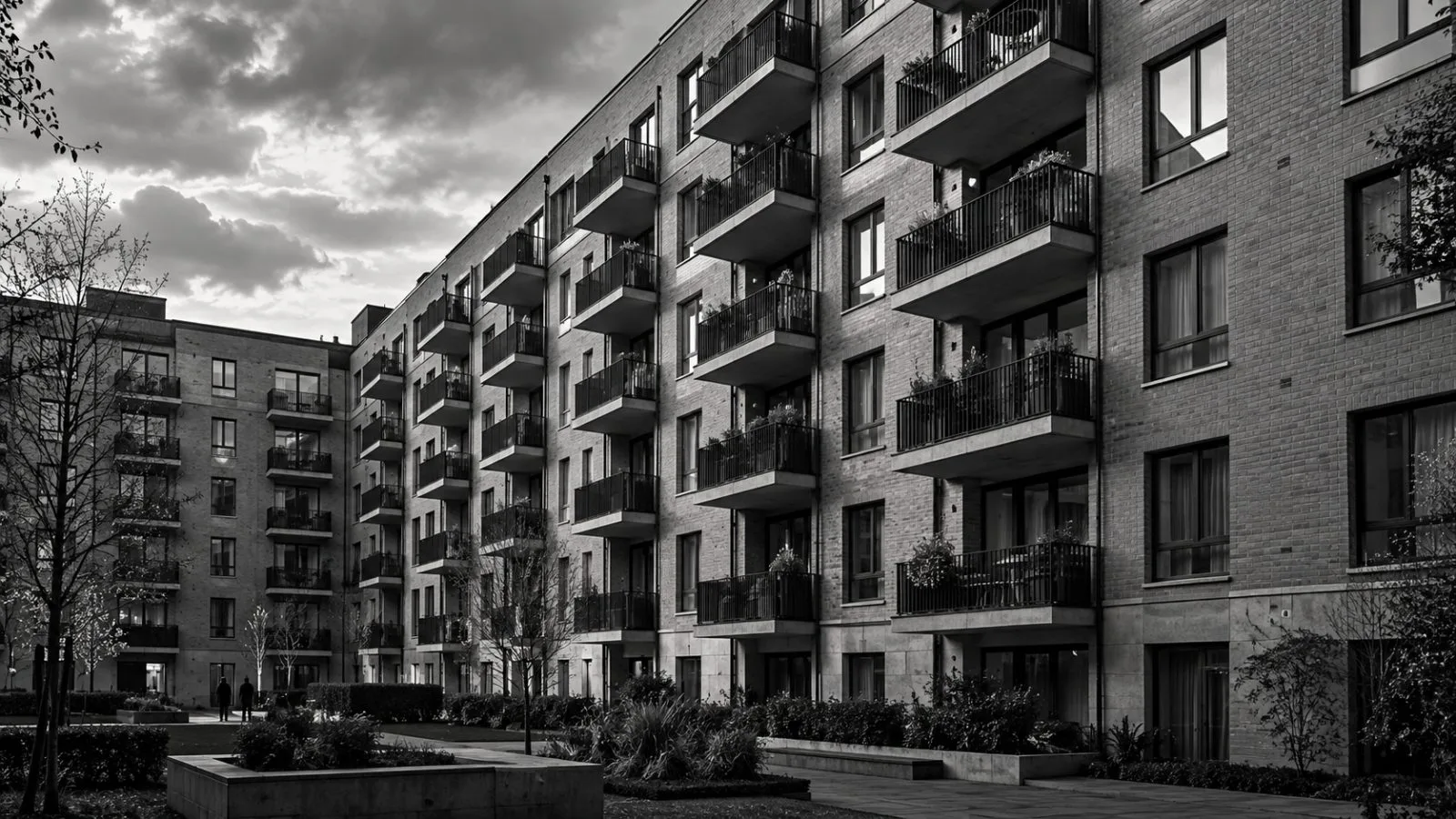 Balconies line a German apartment building in soft afternoon light / TokenPost.ai