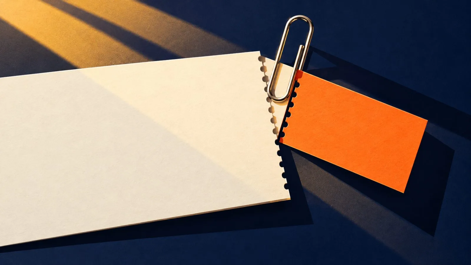 A metal clip separates one blank coupon from an unmarked certificate / TokenPost.ai
