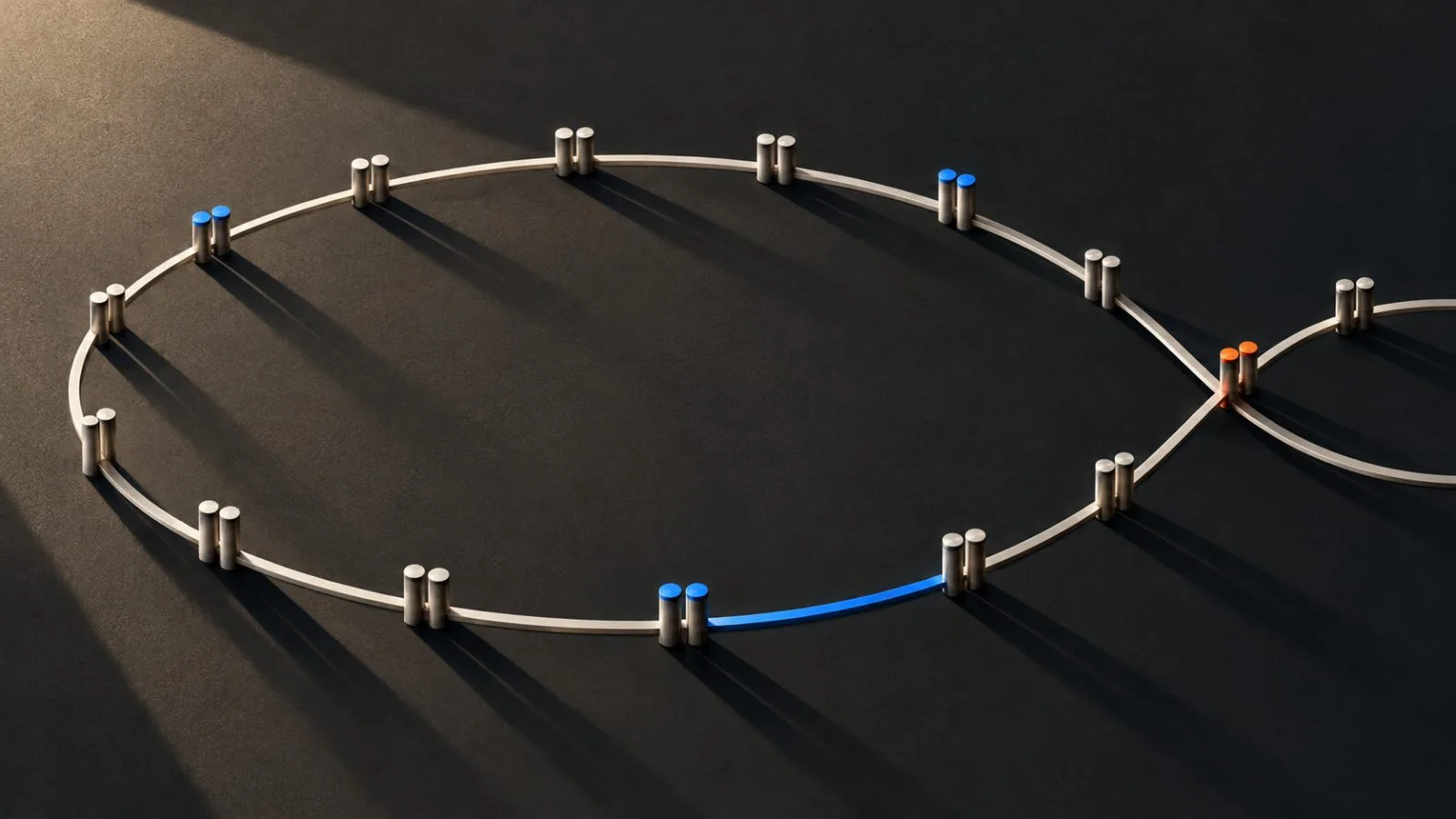 Paired metal pins follow a sculpted curve under warm side light / TokenPost.ai