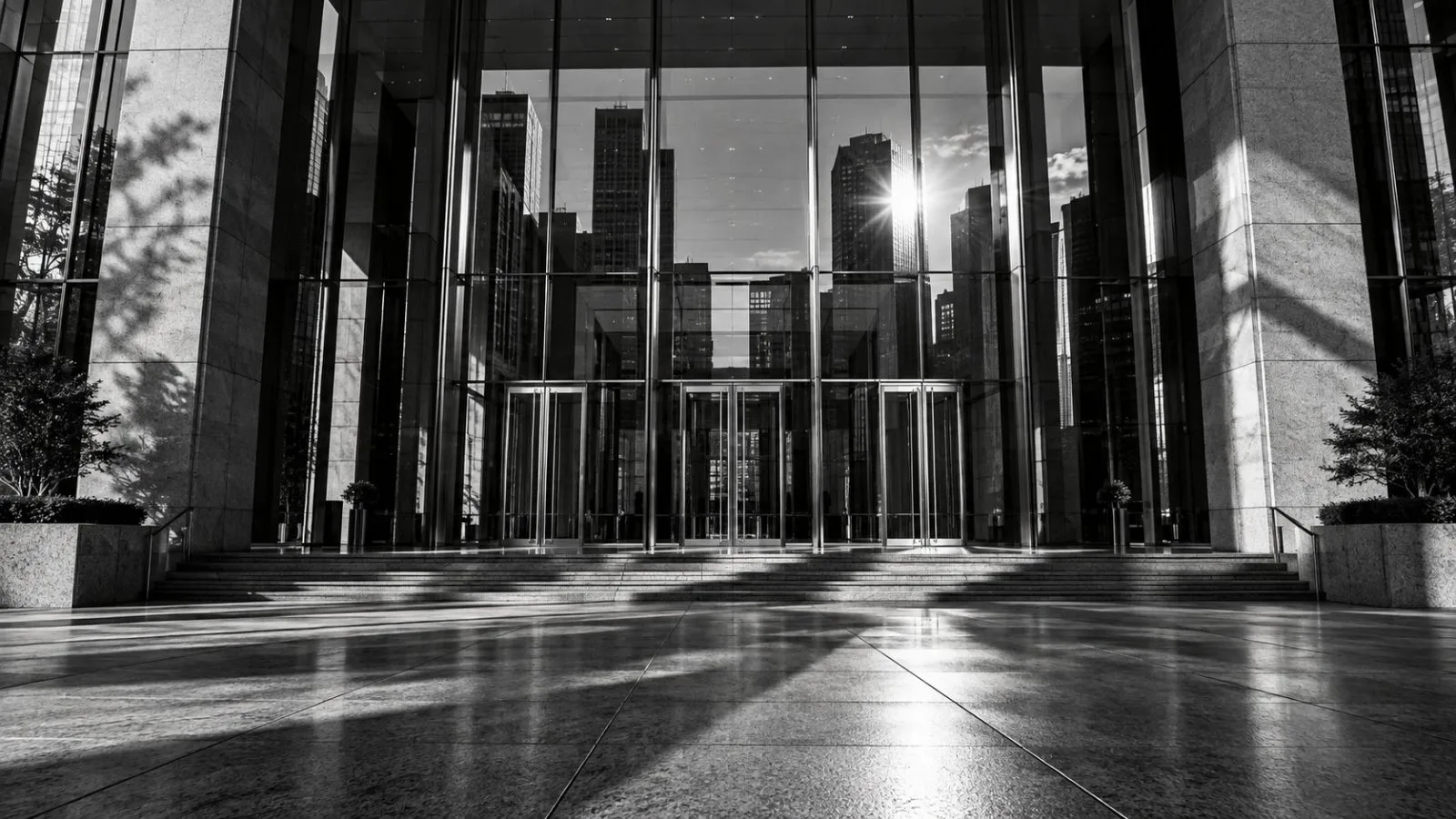 Late afternoon light reflects across an empty summit entrance. / TokenPost.ai