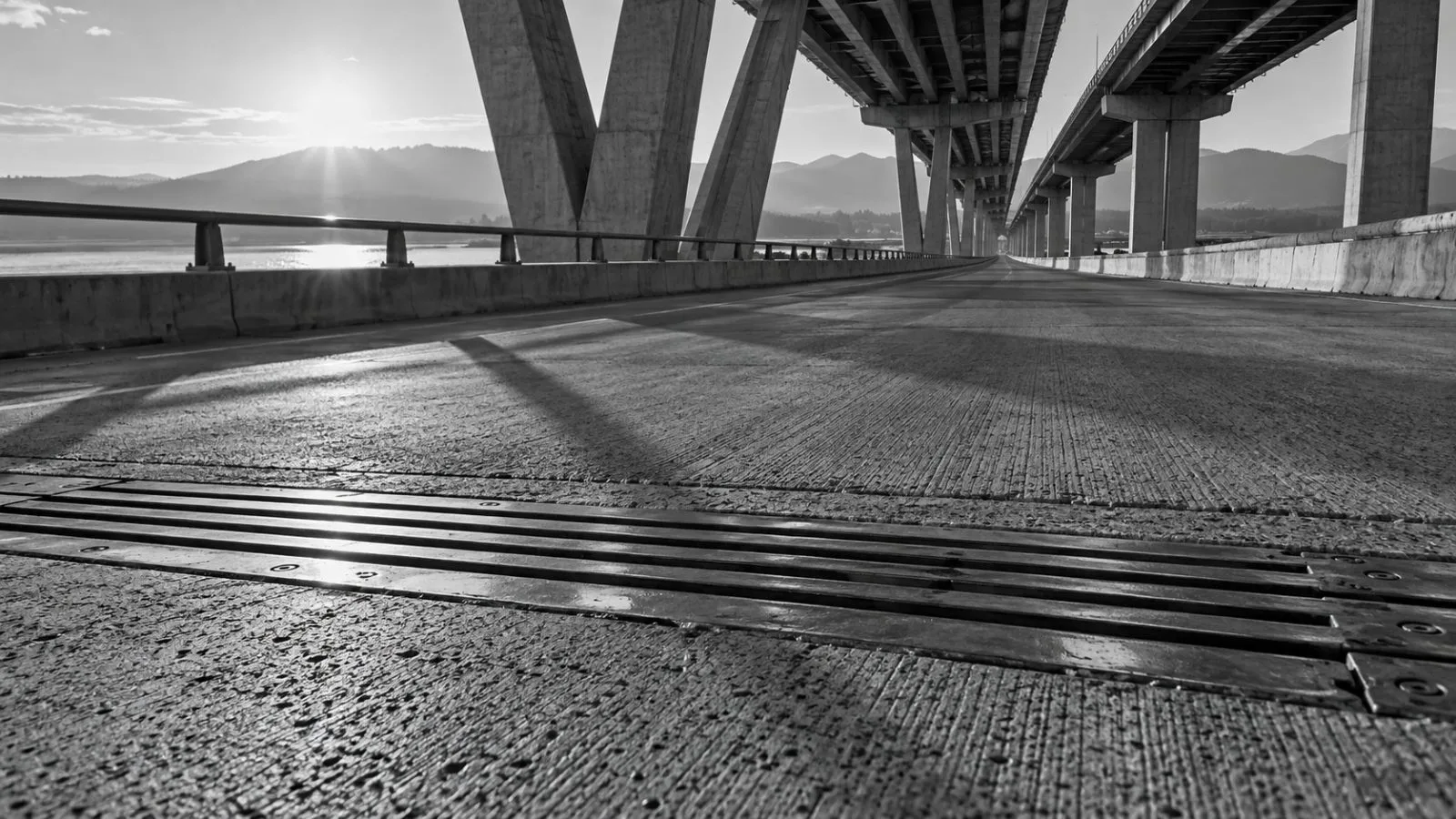 A concrete bridge deck meets a steel expansion joint / TokenPost.ai