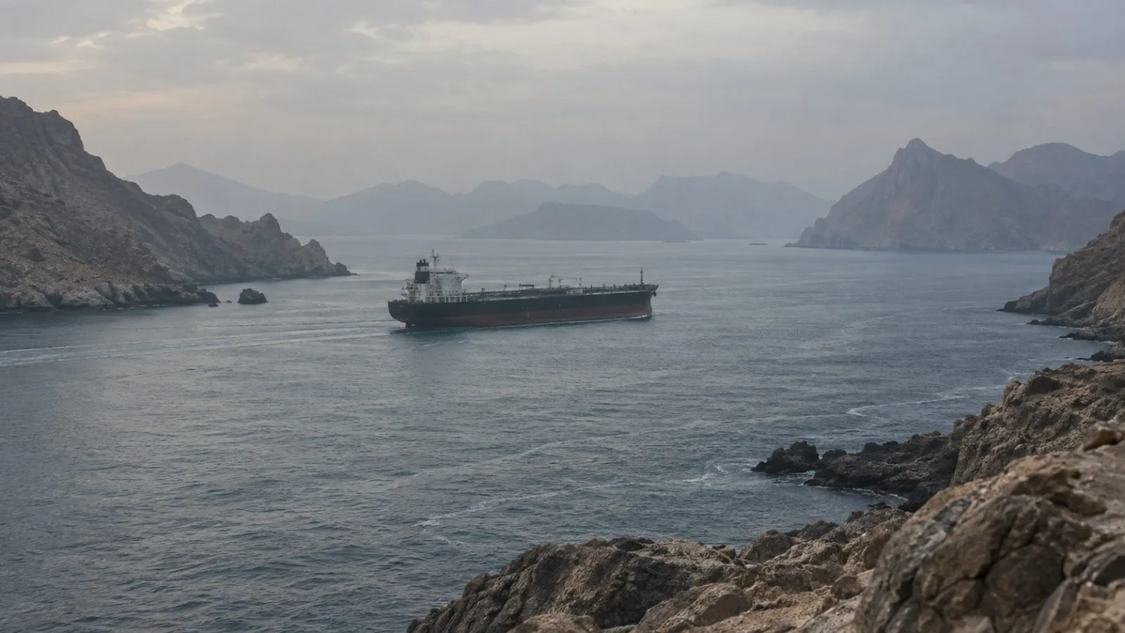 Cargo tanker moving through a narrow strait under hazy daylight / TokenPost.ai
