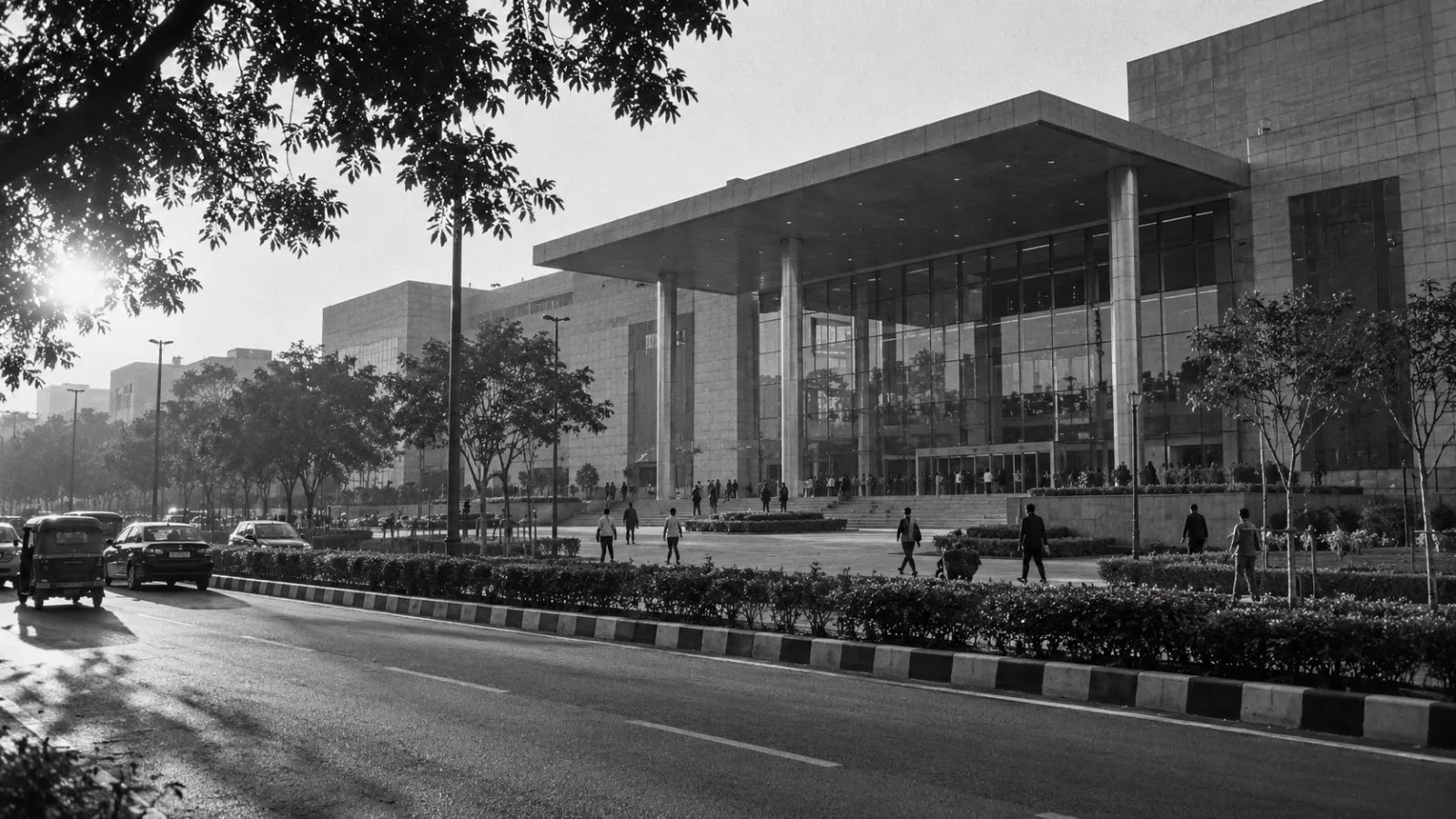 Modern New Delhi venue exterior under warm late afternoon sunlight / TokenPost.ai