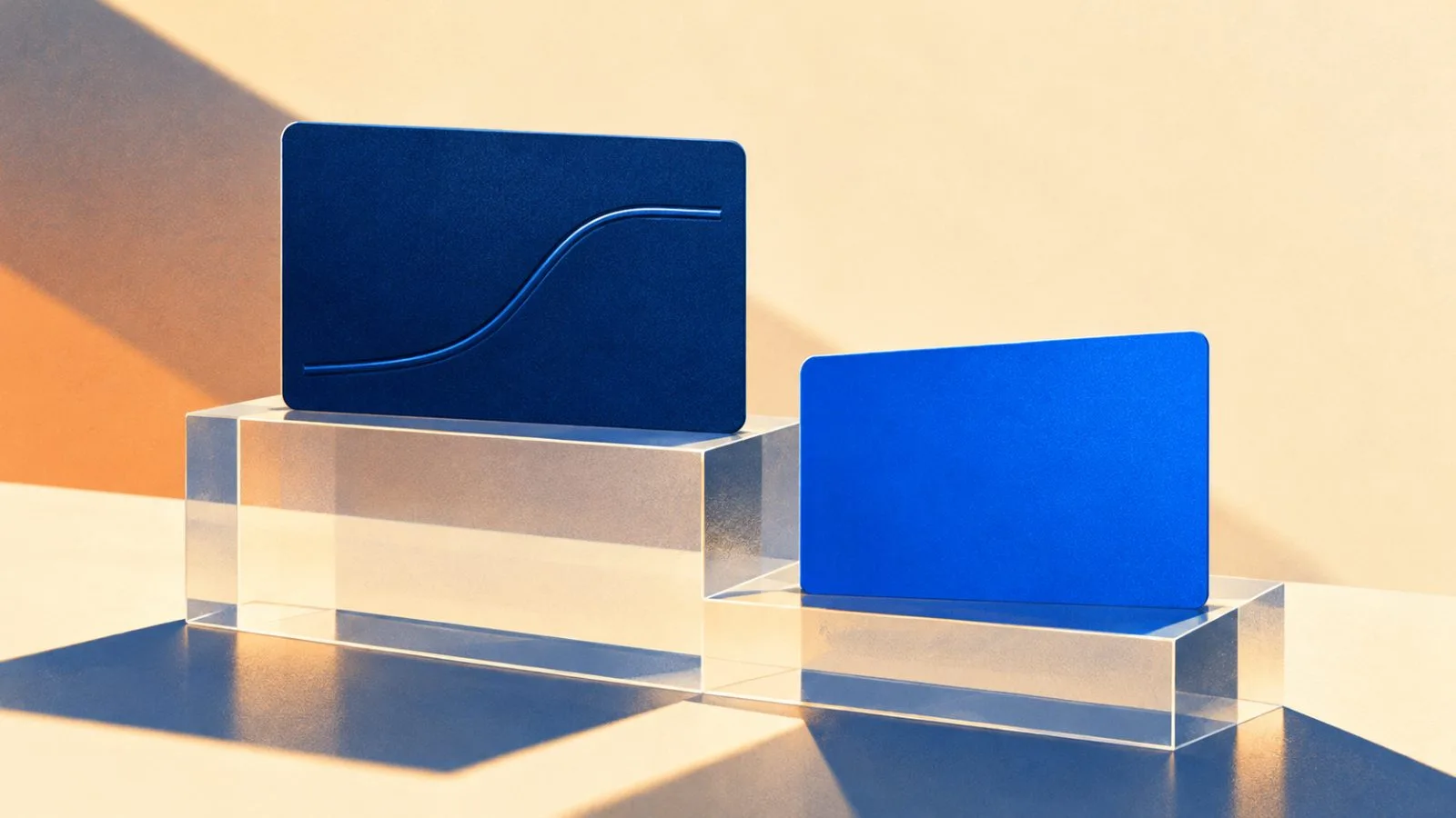 Two blank payout cards rest at different heights on a clear plinth / TokenPost.ai