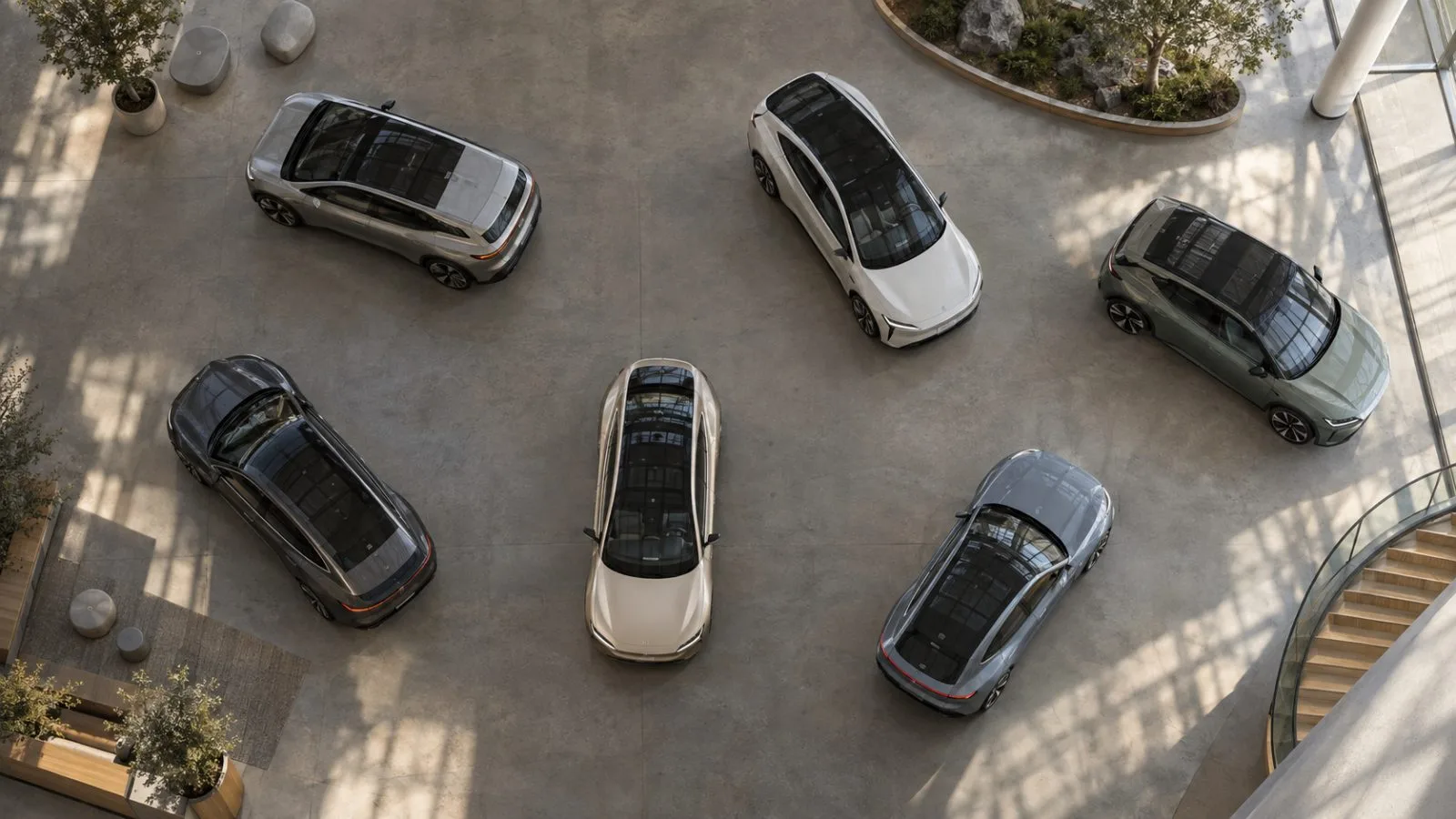 Six electric concept cars displayed beneath skylights in a spacious hall / TokenPost.ai