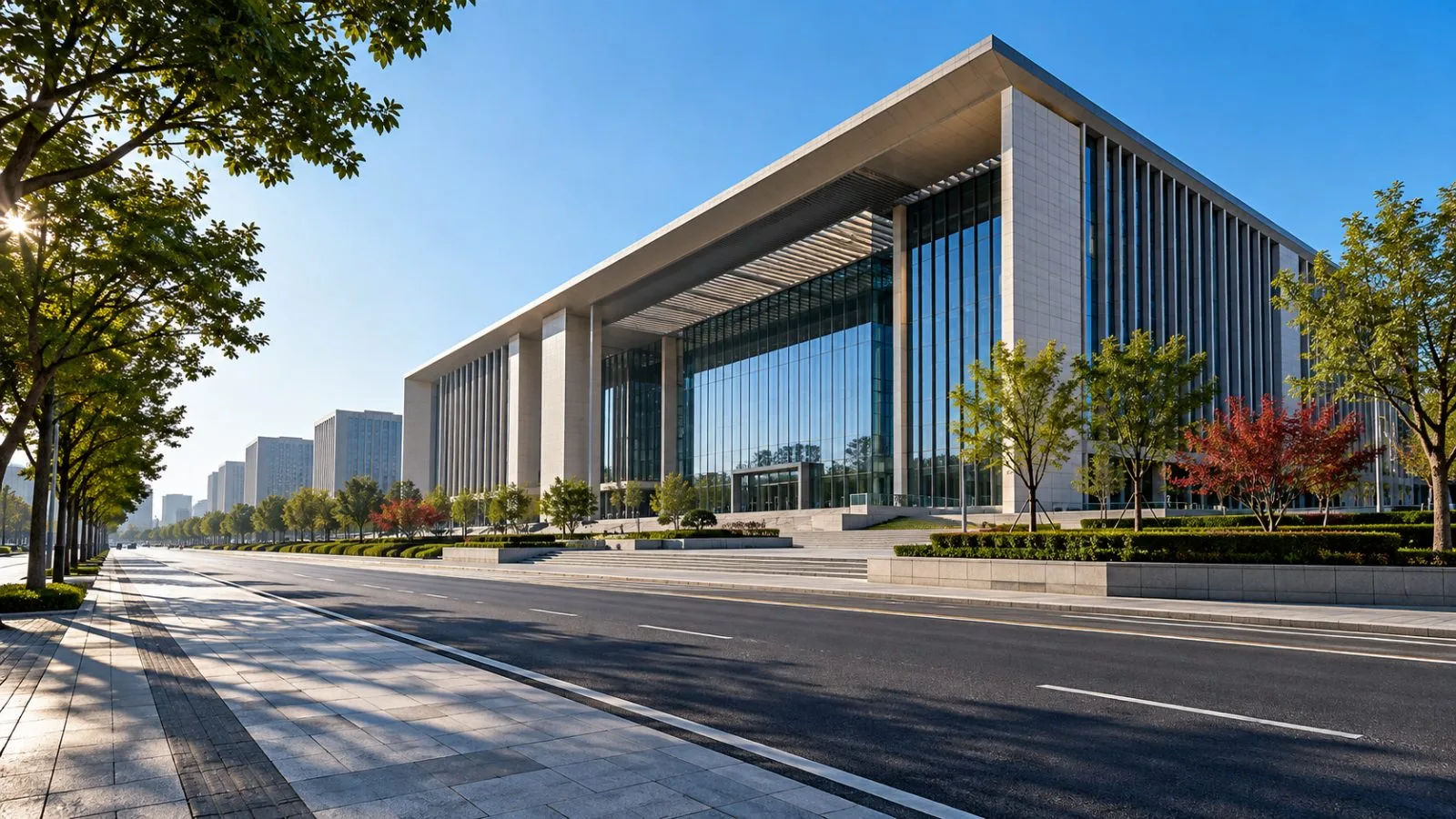 Morning sunlight falls across a quiet avenue and modern buildings. / TokenPost.ai