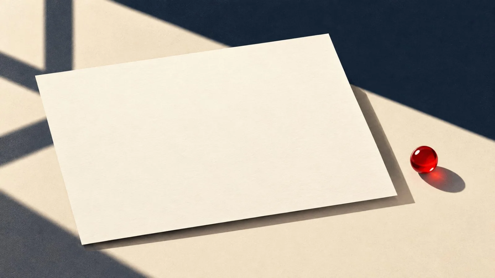 A blank share certificate beside one red glass bead / TokenPost.ai