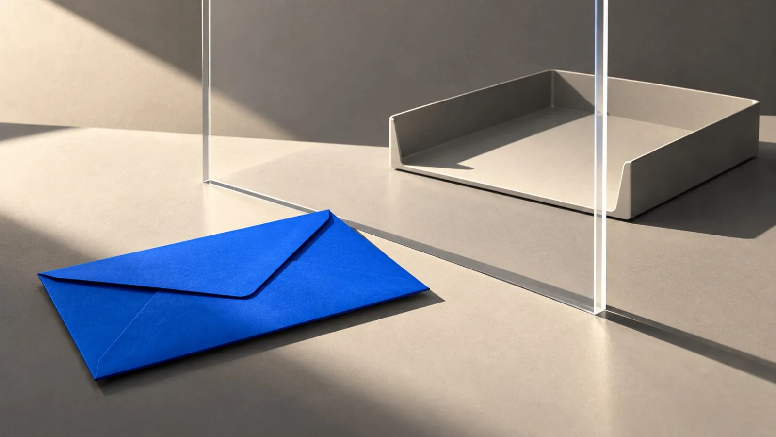 A sealed envelope sits beside a clear acrylic barrier. / TokenPost.ai