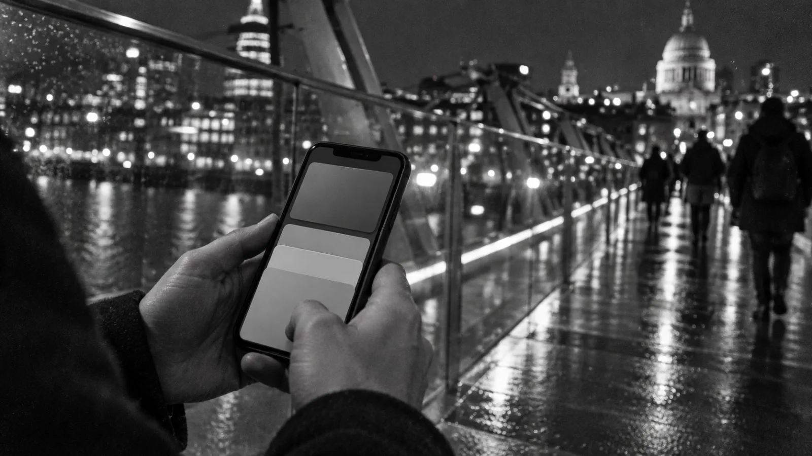 Anonymous hands hold a smartphone beside a glass footbridge / TokenPost.ai