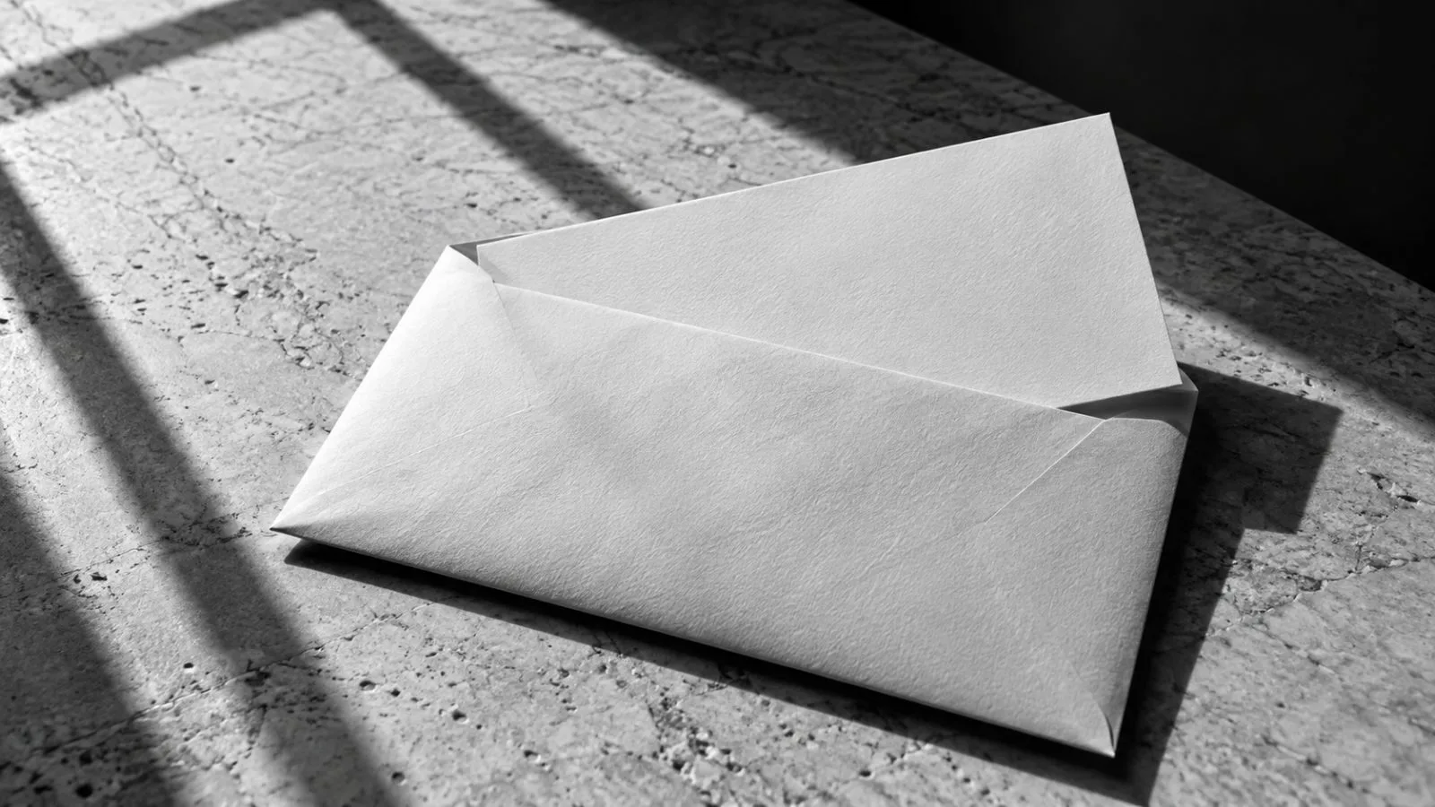 A plain payment check rests partly inside a sealed envelope / TokenPost.ai
