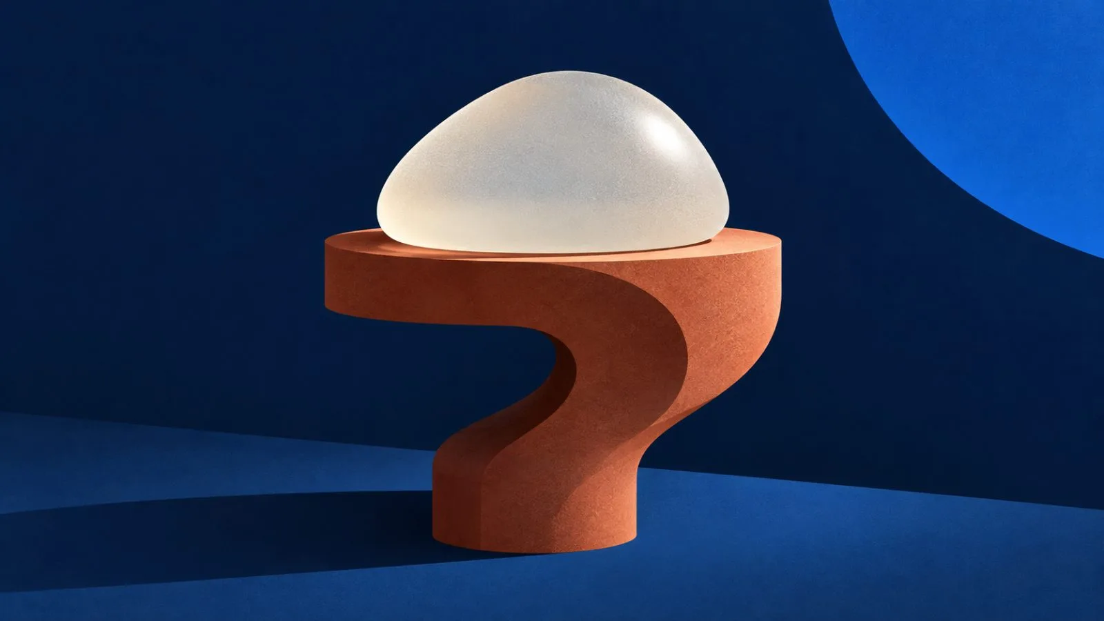 A silicone implant rests on a sculpted terracotta pedestal / TokenPost.ai